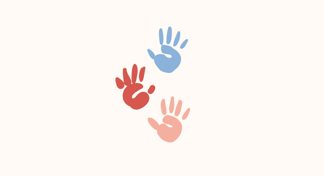 three colored handprints in blue, red and pink