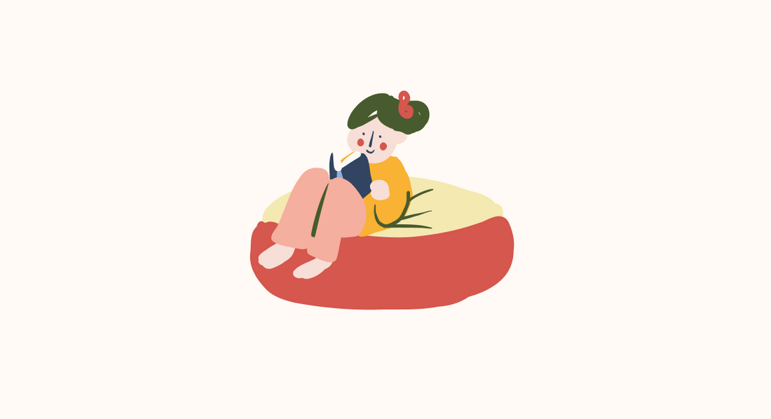 girl reading a book on a beanbag