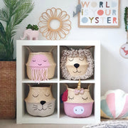 Children's room with decorative storage baskets shaped like animals and a motivational poster.