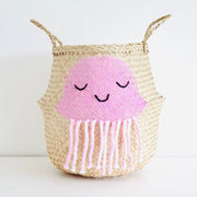 Woven basket with a pink jellyfish  on a white background