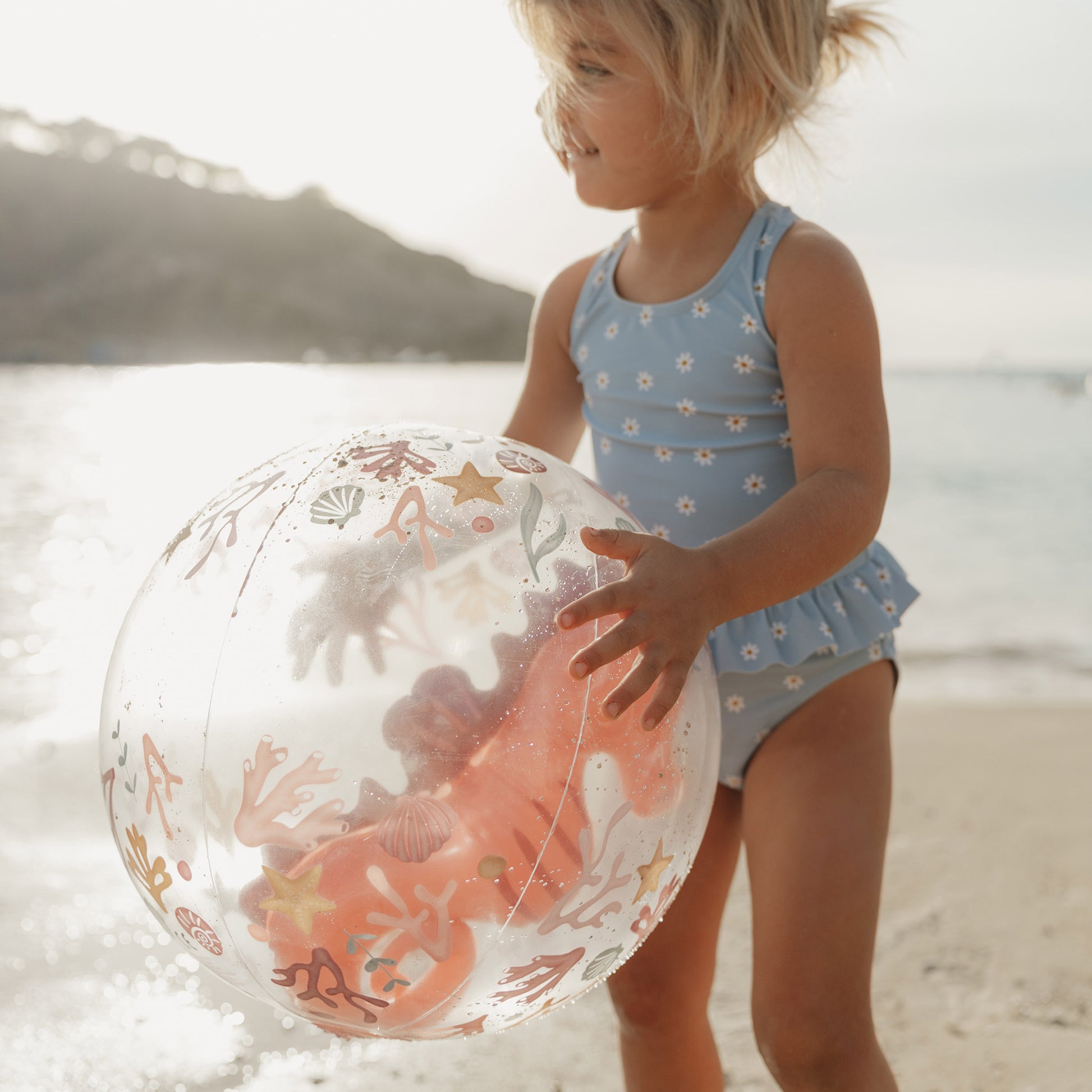Child holding Little Dutch 3D Beach Ball in pink