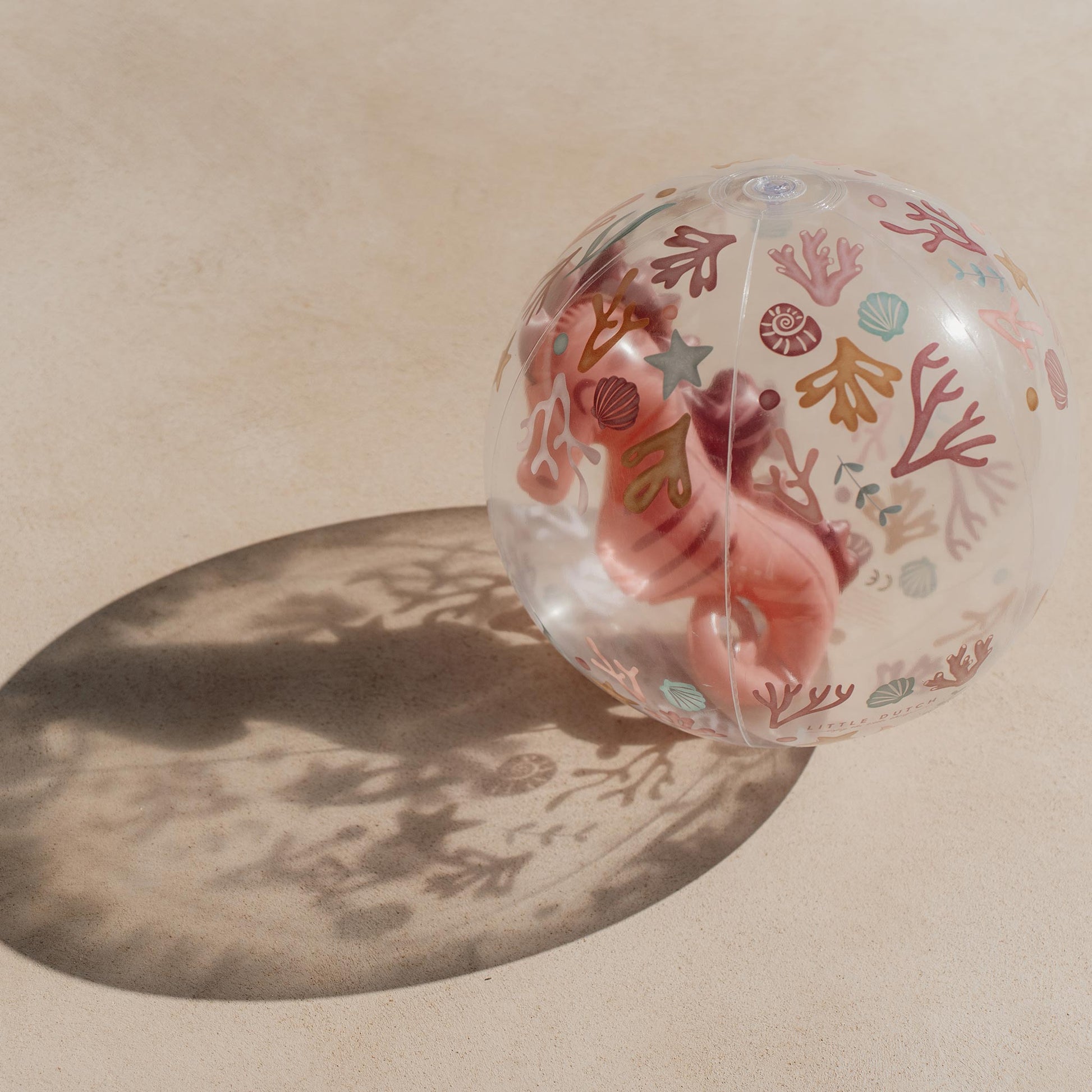Little Dutch 3D Beach Ball casting a shadow on the sand