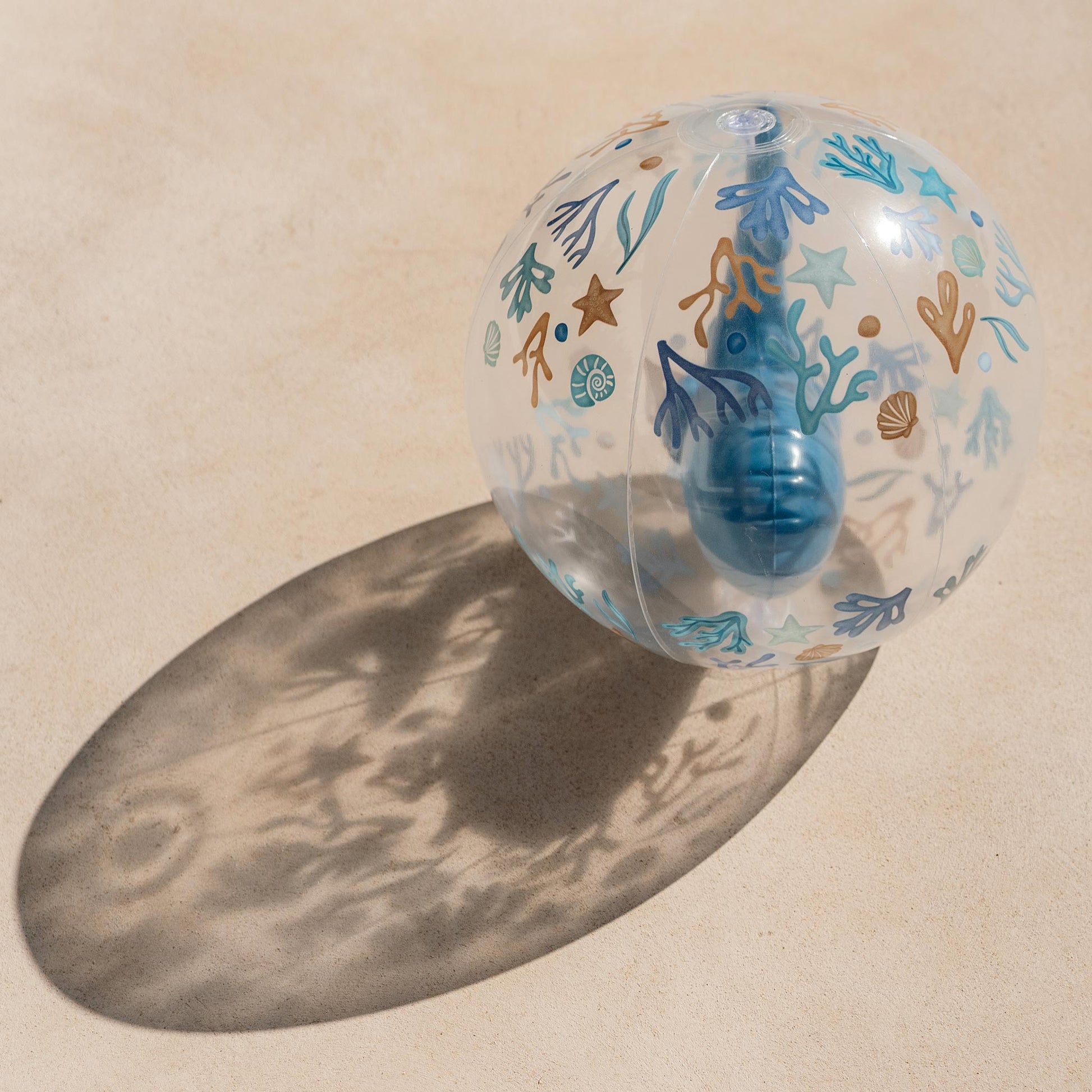 Little Dutch 3D Beach Ball casting a shadow on the sand