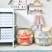 Children's room with decorative baskets, wall art, and shelves.