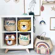 Children's room with decorative baskets, wall art, and toys.