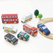 Le Toy Van London Car Set 7 Piece, a wooden vehicle toy set for kids featuring a double-decker bus, black taxi, fire engine, police van, ambulance, and sporty cars. 