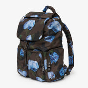 A dark brown backpack featuring a blue rose pattern, shown against a plain light gray background.