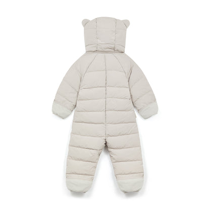 A white puffer snowsuit shown from the back, featuring a hood with bear ears, horizontal quilted padding, long sleeves, and footed legs on a white background.