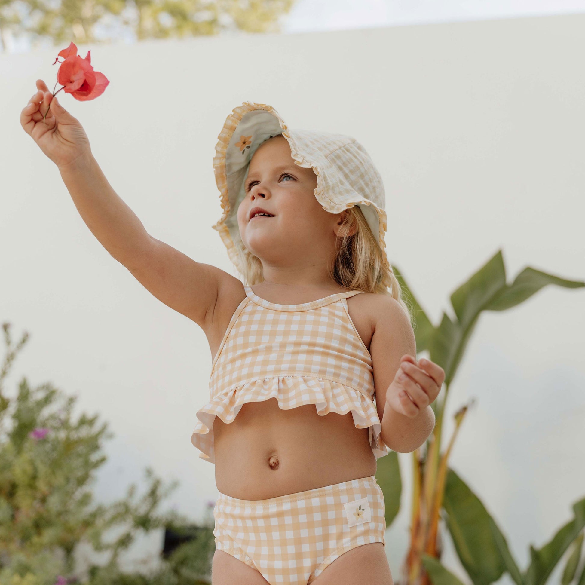 Little girl wearing Little Dutch Reversible Sun Hat