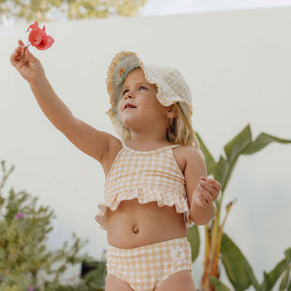 Little girl wearing Little Dutch Reversible Sun Hat