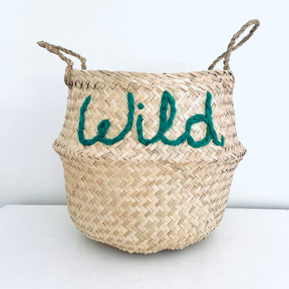 Woven basket with 'Wild' embroidered in green