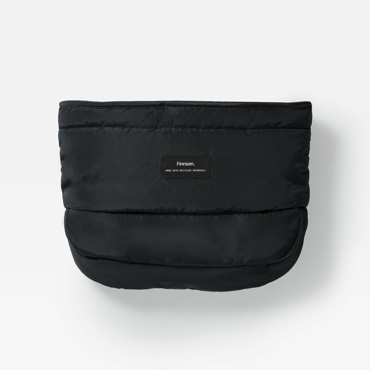 Finnson black puffer-style mono mitten with horizontal quilting and a small central label reading 'Finnson', photographed on a clean white background.
