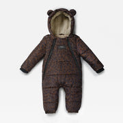A baby puffer snowsuit in a brown and black leopard print pattern, featuring a plush beige fleece-lined hood with bear ears, black zipper details, and a small black brand label on the chest.