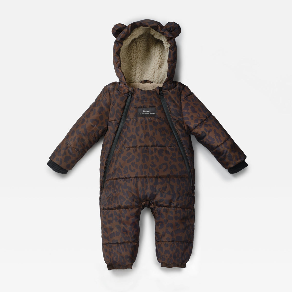 A baby puffer snowsuit in a brown and black leopard print pattern, featuring a plush beige fleece-lined hood with bear ears, black zipper details, and a small black brand label on the chest.