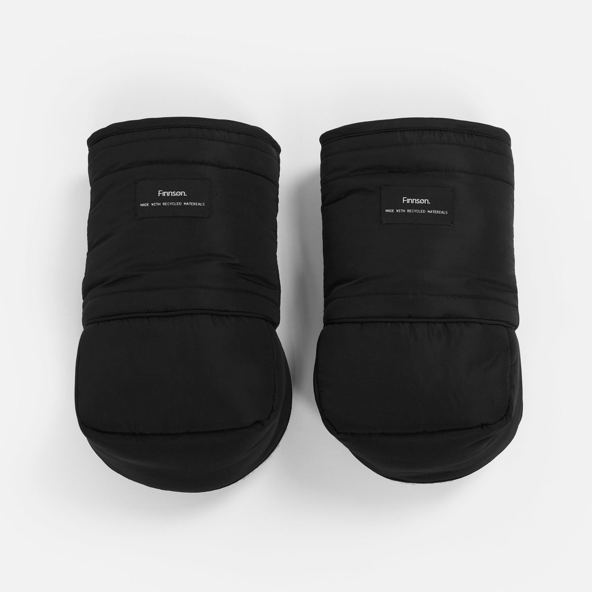 A pair of black puffer-style baby booties with a padded cuff and a small black brand label reading 'Fason' on a clean white background.