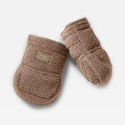A pair of Finnson Borg Stroller Mittens in a warm taupe-brown color, featuring a small tan brand patch on the cuff. The mittens are arranged on a clean, light off-white background.