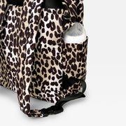 Finnson Leopard print changing bag with a baby bottle inside on a light gray background