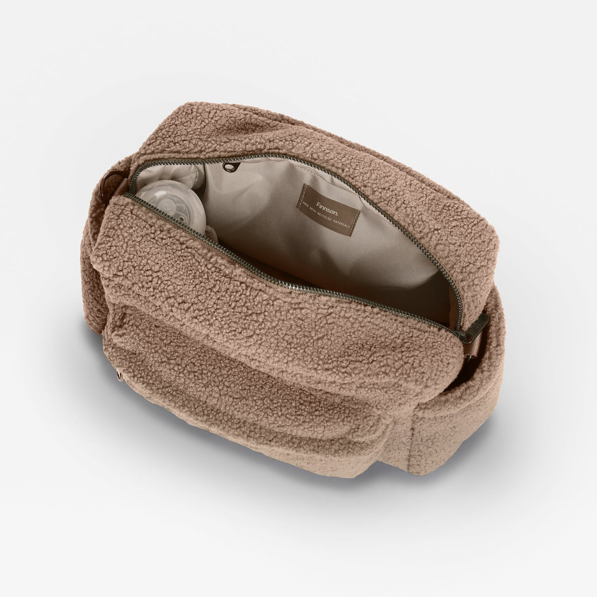 A Finnson oversized mocha brown stroller organiser zippered bag in a textured borg fleece material, shown open to reveal a light beige interior lining on a clean white background.