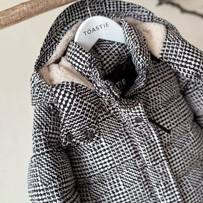 Black and white houndstooth puffer jacket