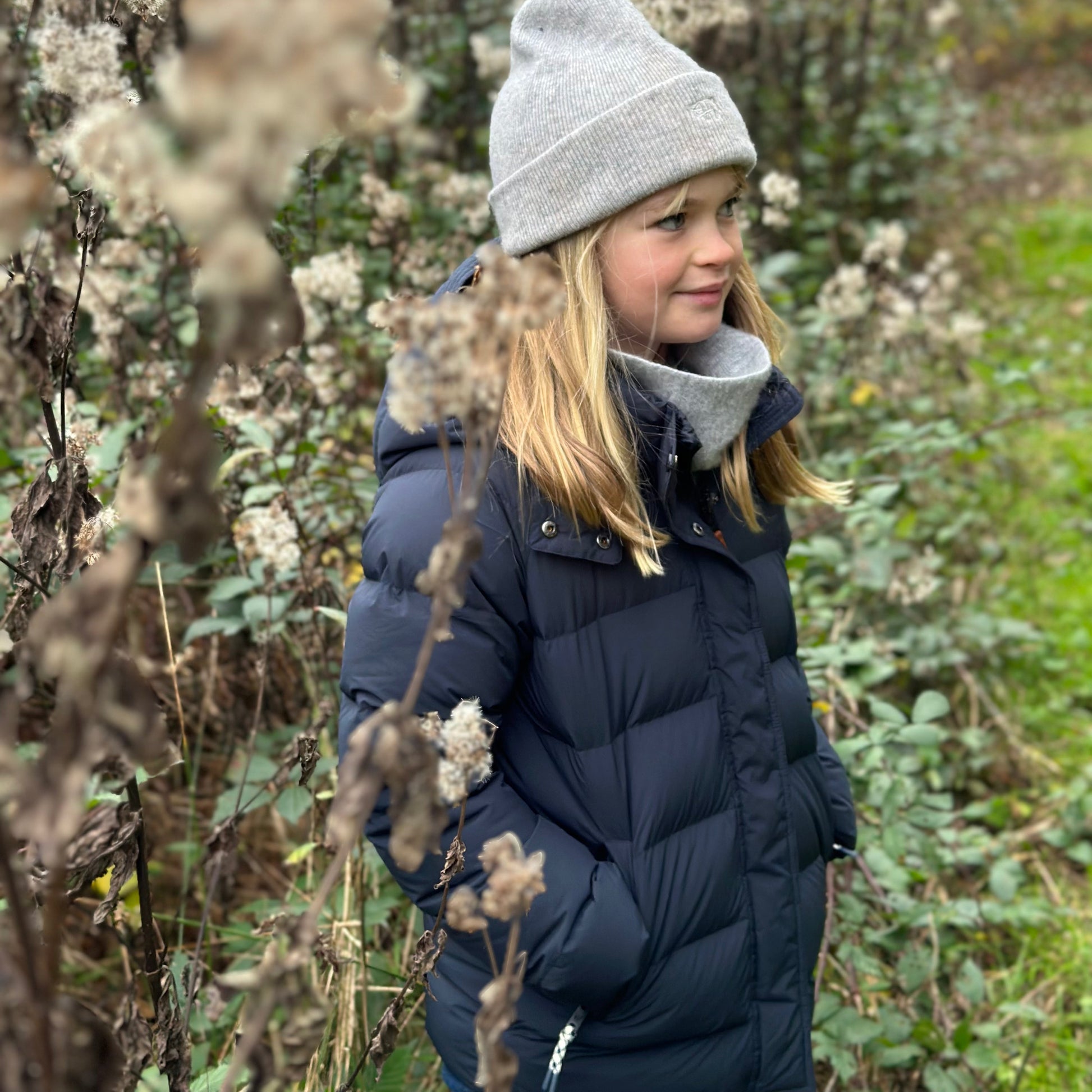 Girl wearing a navy blue puffer parka