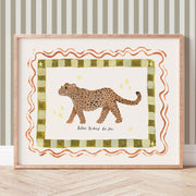 Framed artwork of a leopard on a striped background with the phrase 'Be brave, be kind, be you'