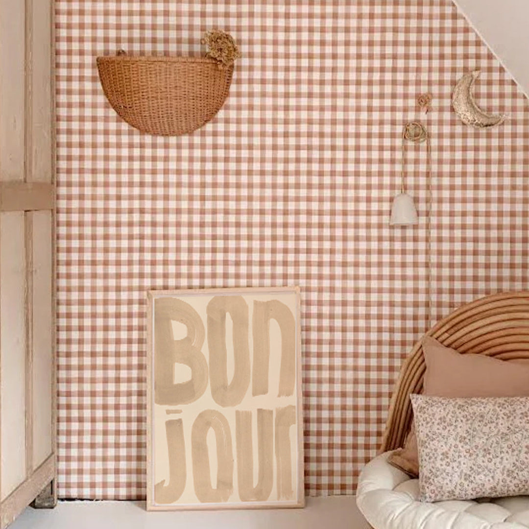 Wall with checkered pattern, decorative items, and 'Bonjour' sign in a room.