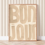 Wooden sign with 'BONJOUR' text on a striped wall background