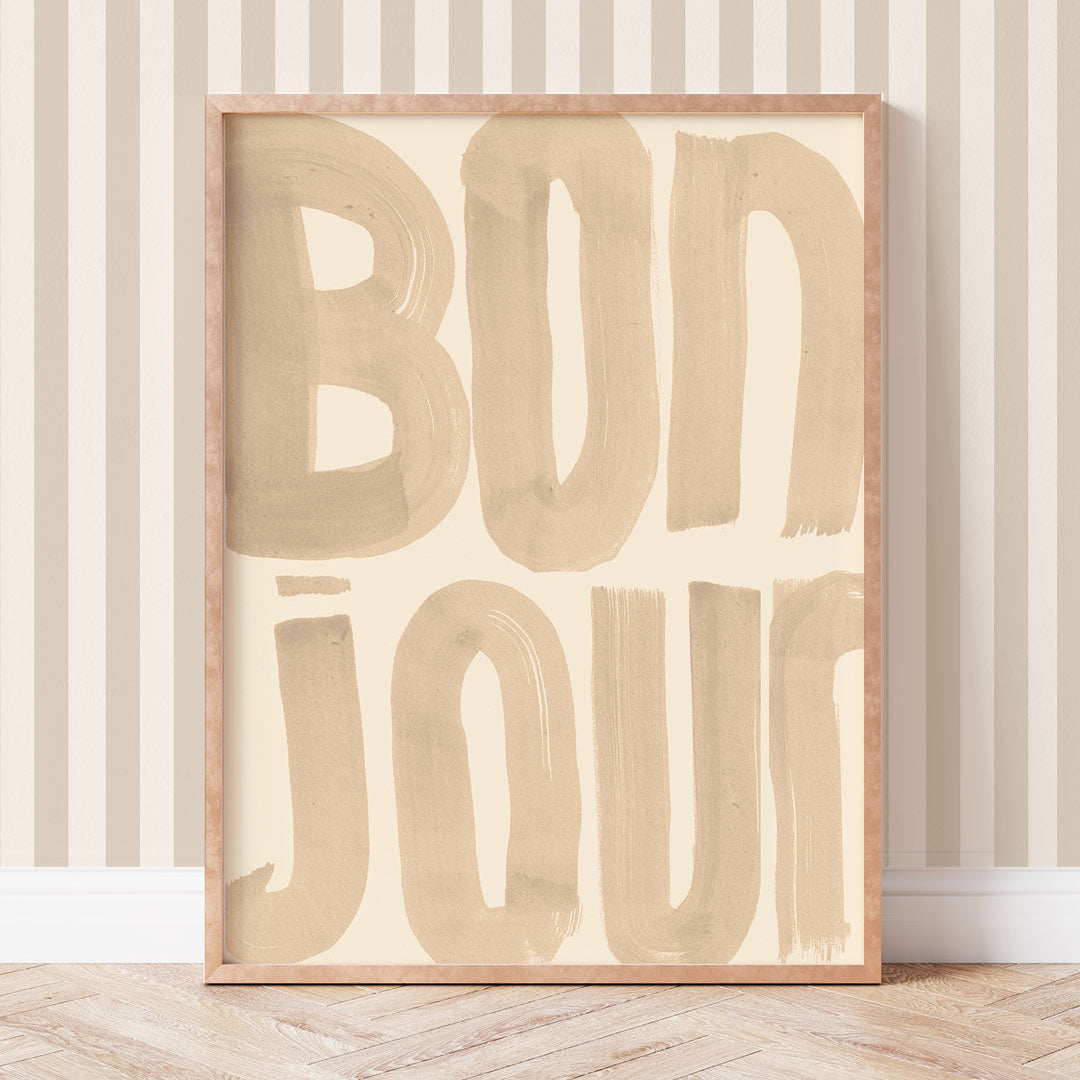 Wooden sign with 'BONJOUR' text on a striped wall background