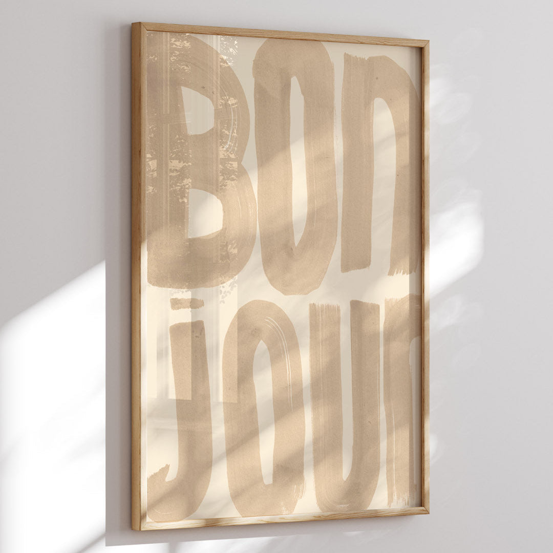 Framed artwork with 'BONJOUR' text on a light background