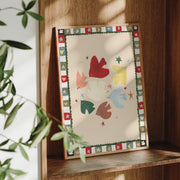 Framed artwork with colorful abstract design on a wooden shelf.