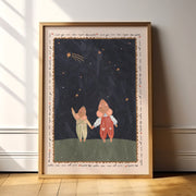 Framed artwork of two mice holding hands under a starry sky on a wall.