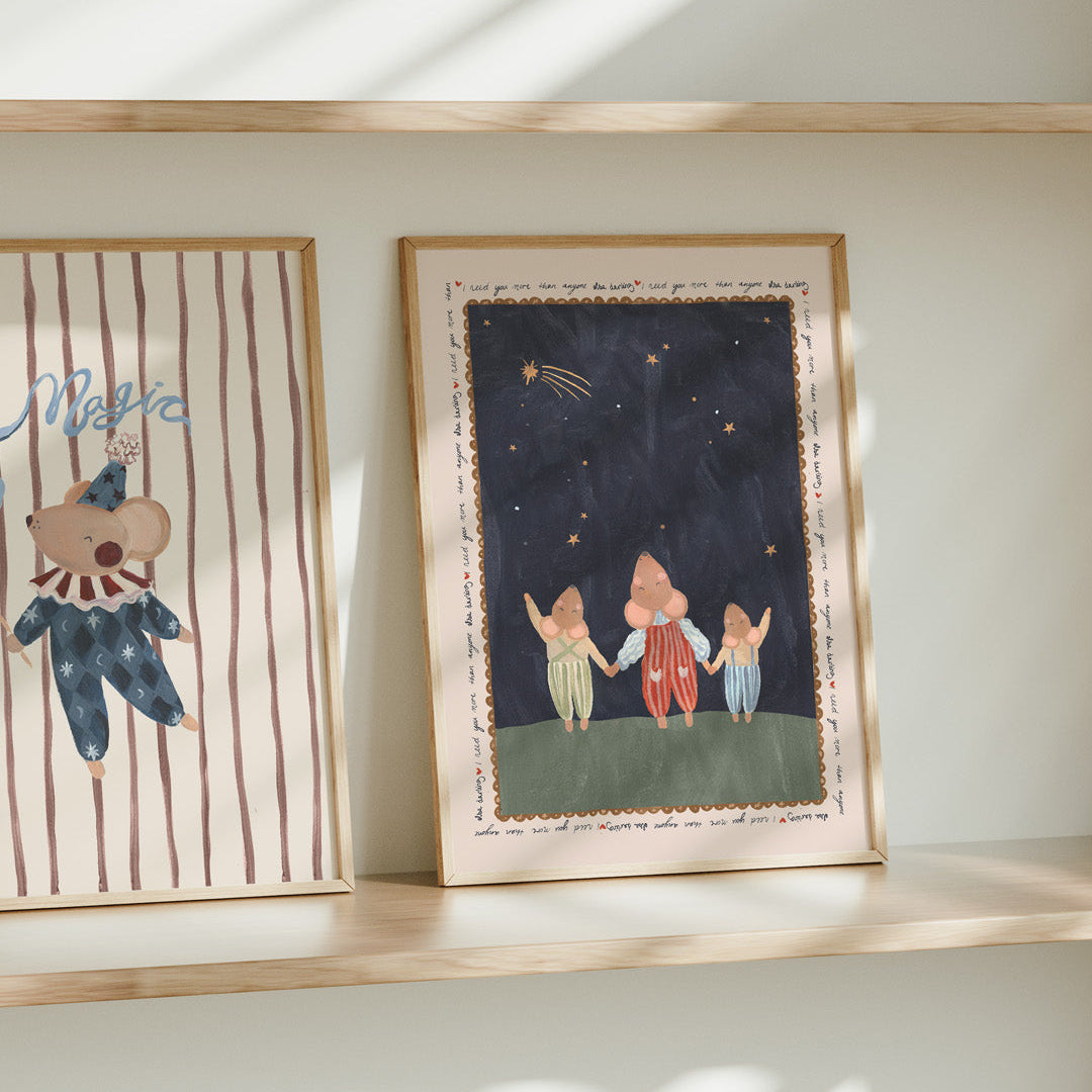 Two framed illustrations on a shelf with a light background