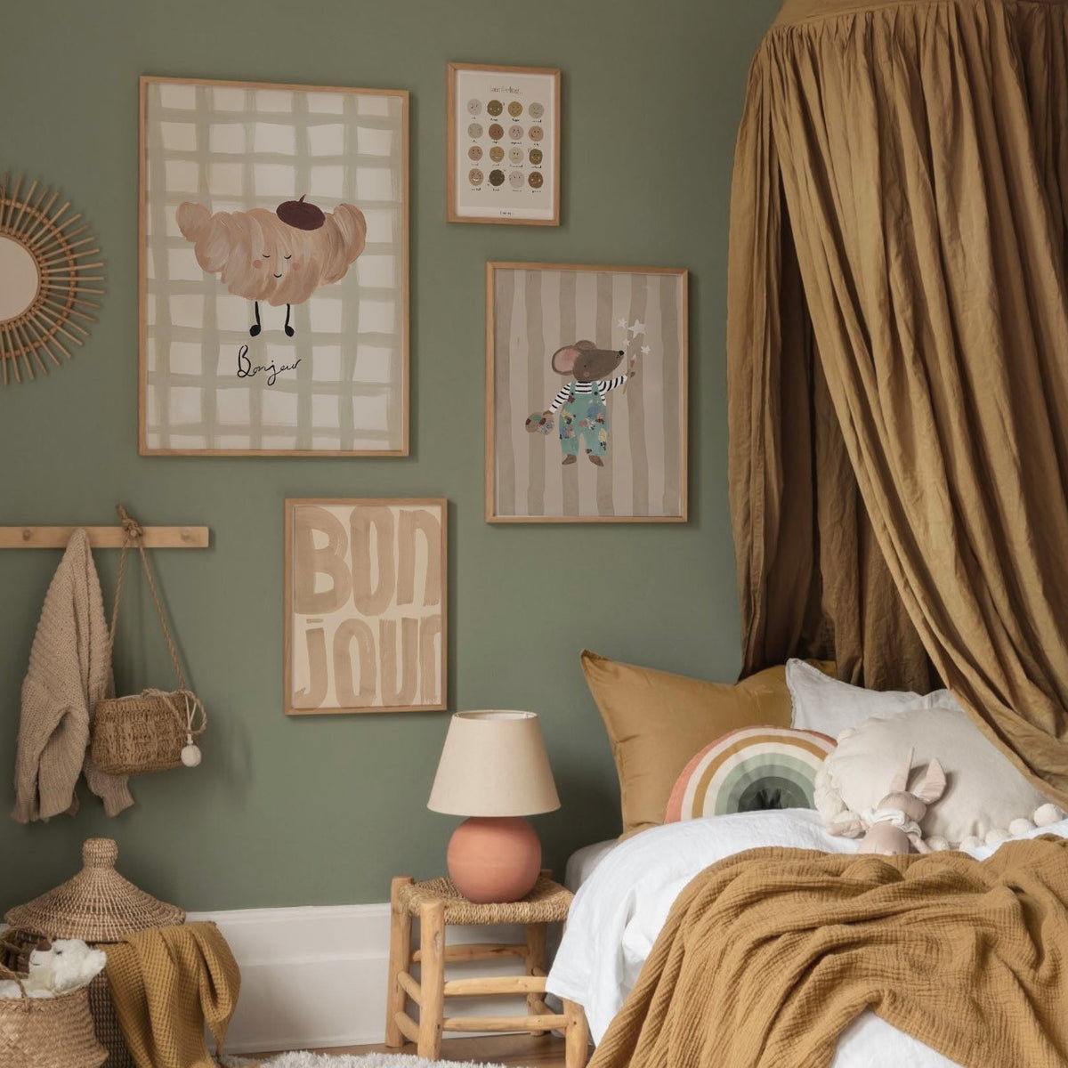 Children's bedroom with green walls, framed artwork, and a bed with brown bedding.