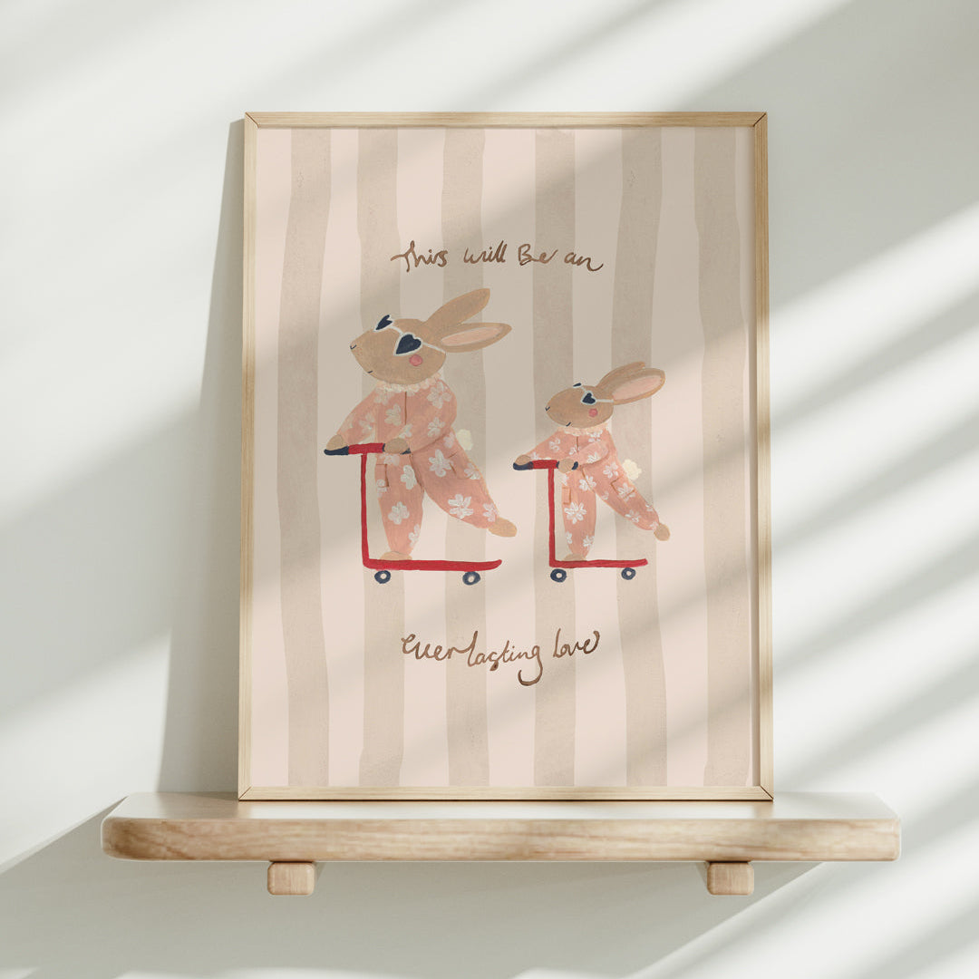 Framed artwork with cartoon bunnies on scooters and text on a striped background
