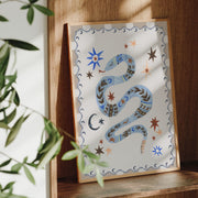 Decorative print with a snake design on a wooden shelf.