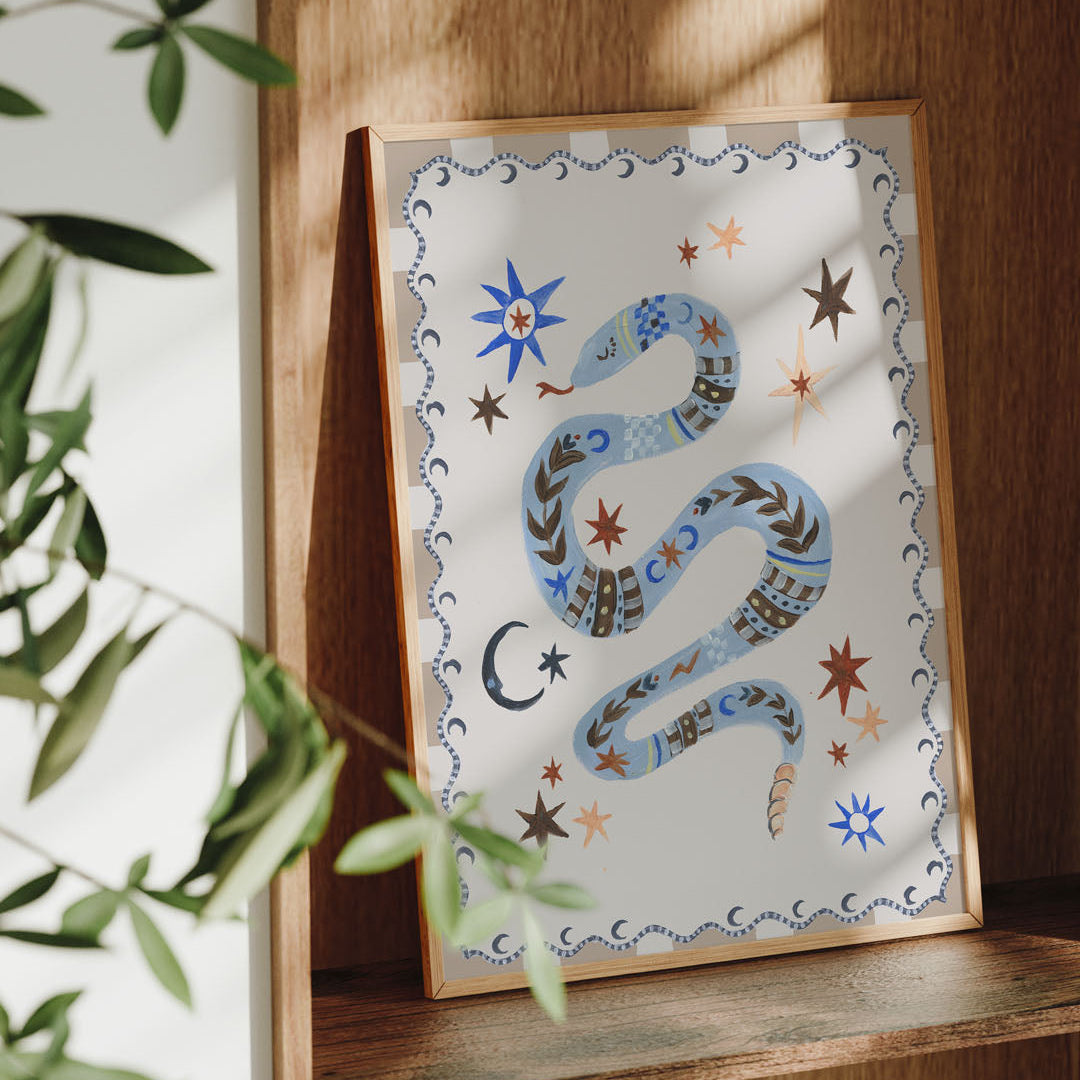 Decorative print with a snake design on a wooden shelf.