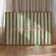 Striped wall art with 'HOW LUCKY WE ARE' text in a room with curtains and wooden floor.