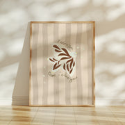 Framed artwork featuring a dove and the words 'I adore you' on a striped background