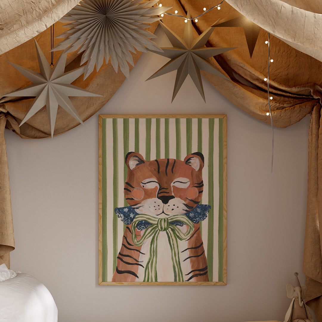 Framed artwork of a tiger wearing a bow