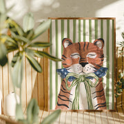 Framed artwork of a tiger with a bow tie on a striped background