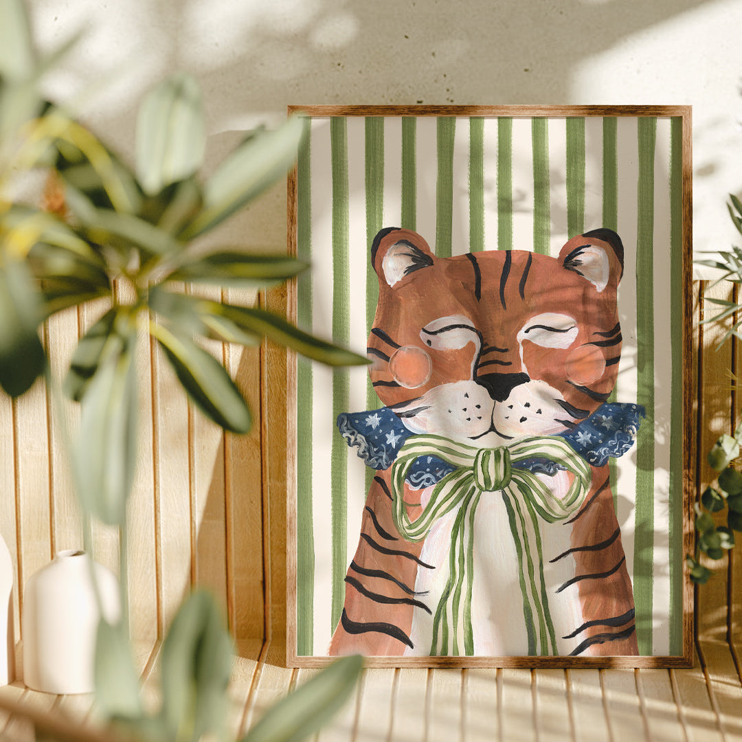 Framed artwork of a tiger with a bow tie on a striped background