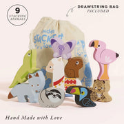 Le Toy Van Andes Animal Stacker, a set of nine wooden stacking animals including a llama, sloth, flamingo, lizard, toucan, butterfly, fox, leopard, and capybara, displayed with a cotton drawstring bag. 