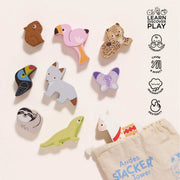 Le Toy Van Andes Stacking Animals, a set of 9 wooden animals including a llama, sloth, flamingo, lizard, toucan, butterfly, fox, leopard, and capybara, along with a cotton drawstring bag. 