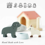 Le Toy Van Dolls House Pet Set, featuring a wooden dog, cat, kennel, and pet bowl, promoting learning, creativity, coordination, social skills, imagination, and dexterity. 