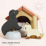 Le Toy Van Dolls House Pet Set featuring a wooden dog, cat, kennel with bed, scratching post, and food bowl, perfect for dollhouse families. 