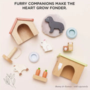 Le Toy Van Dolls House Pet Set featuring a kennel, dog, cat, scratching post, pet bowl, and other charming pet accessories. 