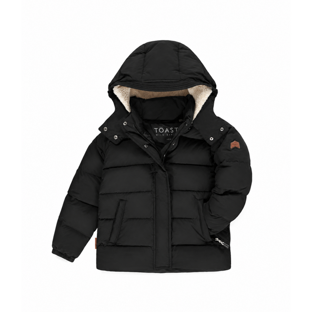 A black hooded puffer jacket with a beige sherpa-lined hood, front zipper and snap closure, and front pockets, shown on a plain white background.