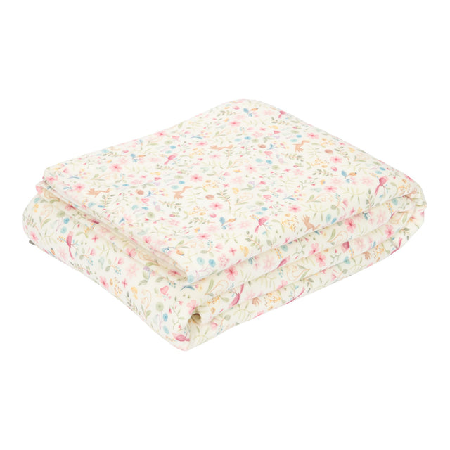 Folded blanket with flowers and small creatures
