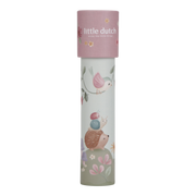 A tall cylindrical Kaleidoscope with a pink lid and a pale green body decorated with whimsical woodland illustrations, including a pink bird, hedgehog, flowers, and mushrooms. The lid reads 'little dutch baby bath accessories'.