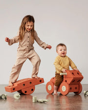 Two children playing with the MODU burnt orange Dreamer Set.